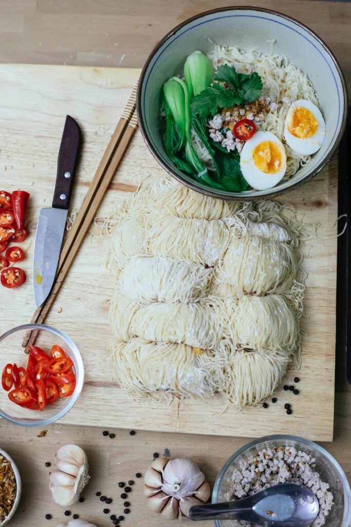 Ramen, noodles and cutting board